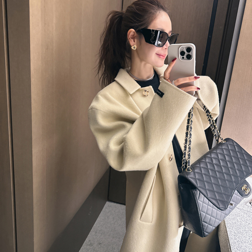 Scarlet hand over coat