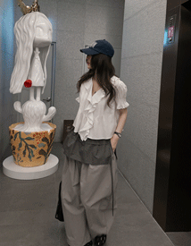 Sage short-sleeved frill blouse